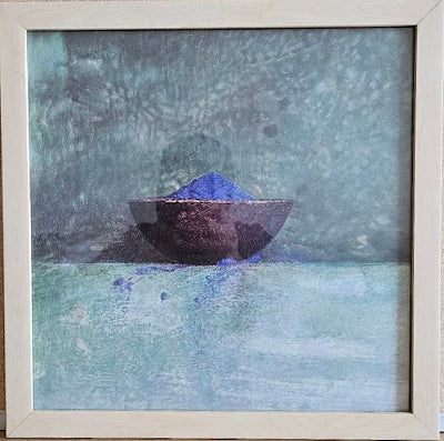 Framed artwork of a purple bowl with blue powder on a textured background