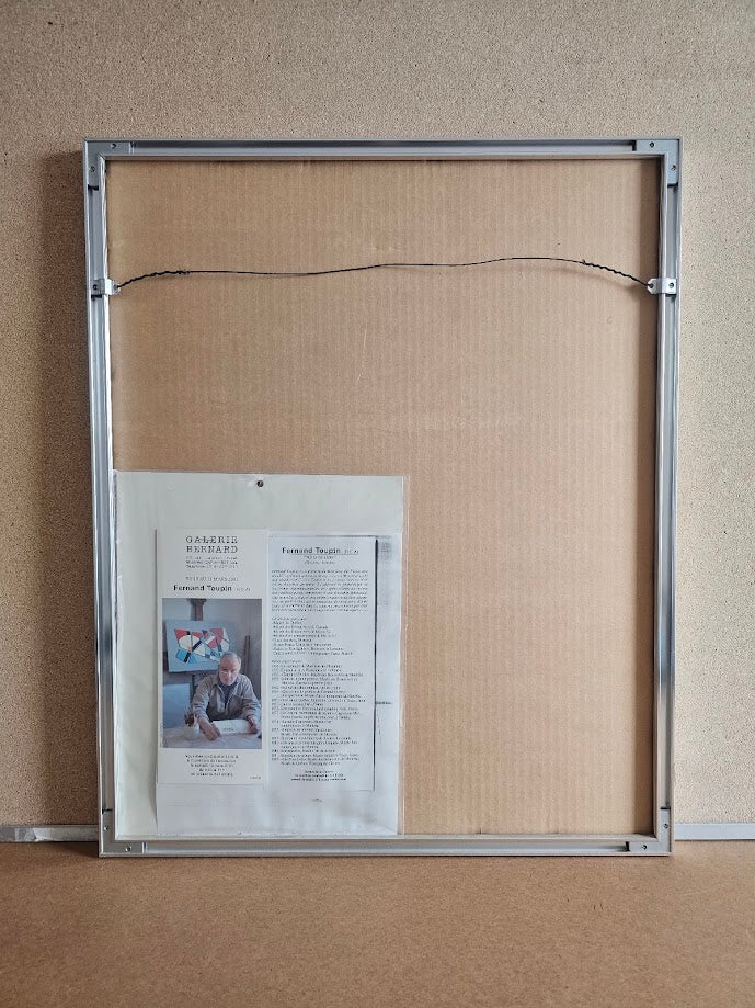 Metal frame with a poster attached on a textured wall