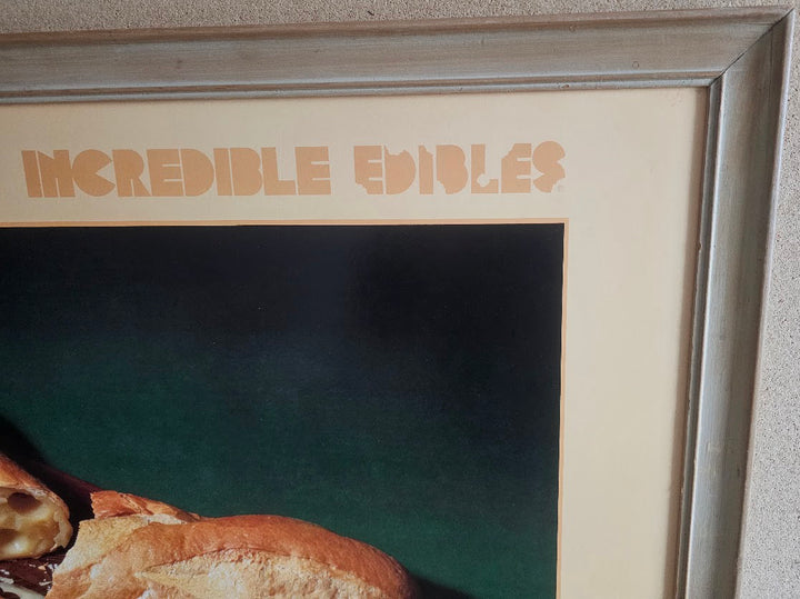 Framed artwork with 'Incredible Edibles' text and food items.
