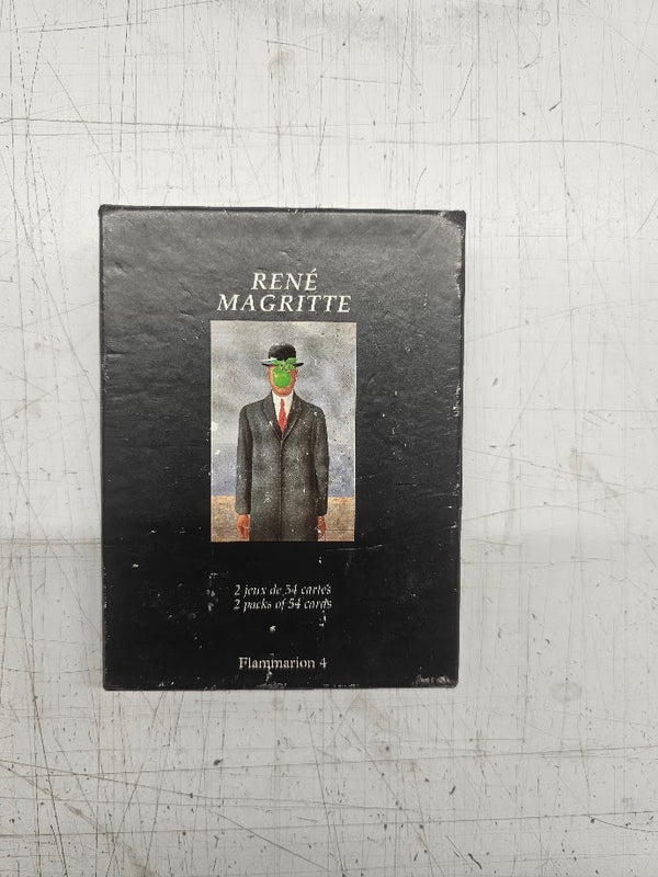 Book cover of René Magritte with a painting of a man in a suit on a metal surface