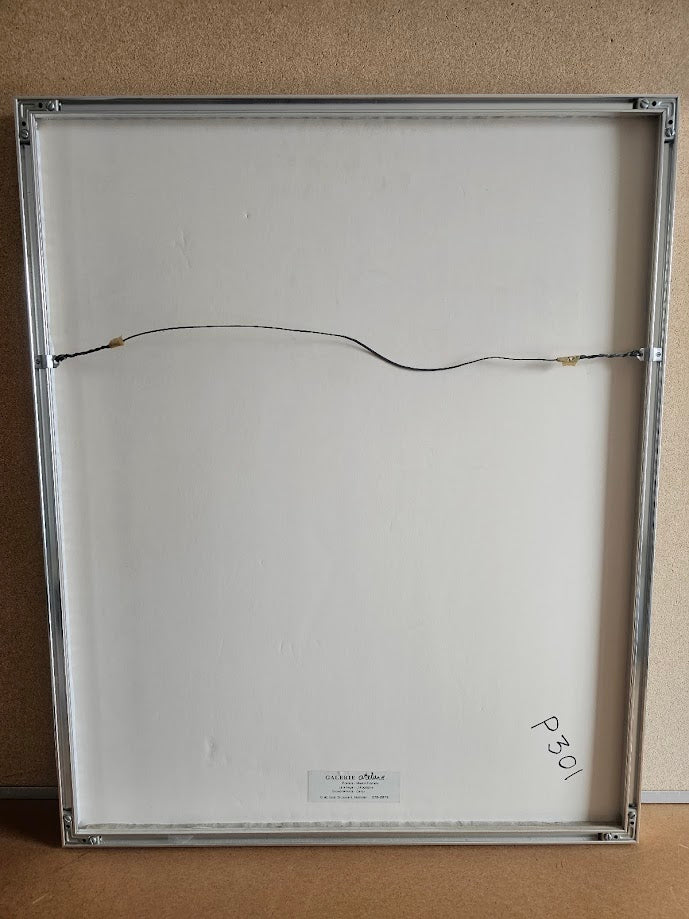 Back of a framed artwork with a wire and label on a neutral background