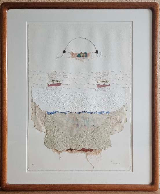 Framed artwork with a textured white surface and wooden frame