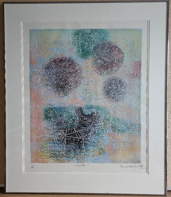 Framed abstract artwork with circular designs on a textured background