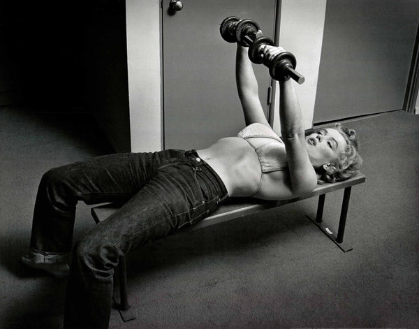 Marilyn Monroe with Weights, 1952 by Philippe Halsman - 22 X 28 Inches (Art Print)