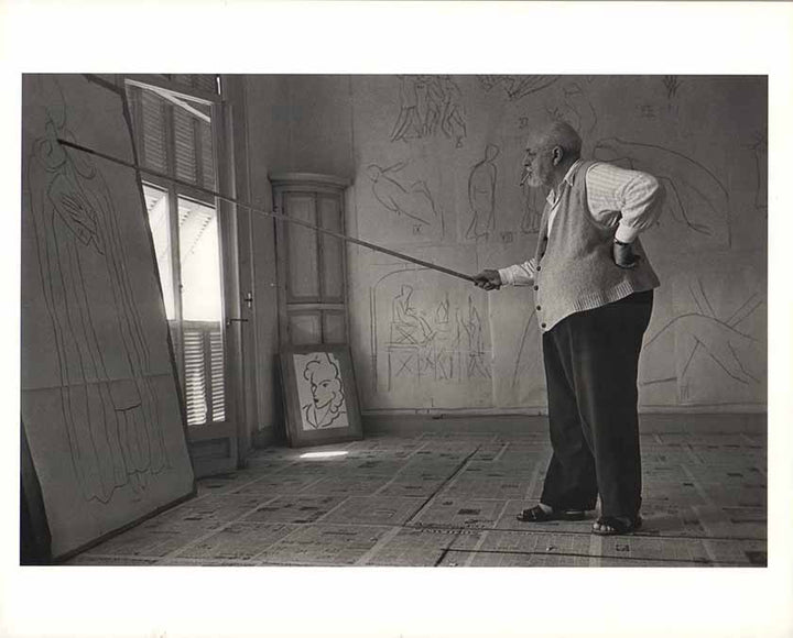 Henri Matisse drawing with a bamboo pole tipped with charcoal, August 1948 by Robert Capa - 10 X 12 Inches (Offset Lithograph)
